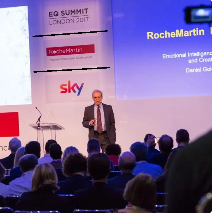 Roche martin is presenting a seminar and giving his knowledge about psychology of rich people